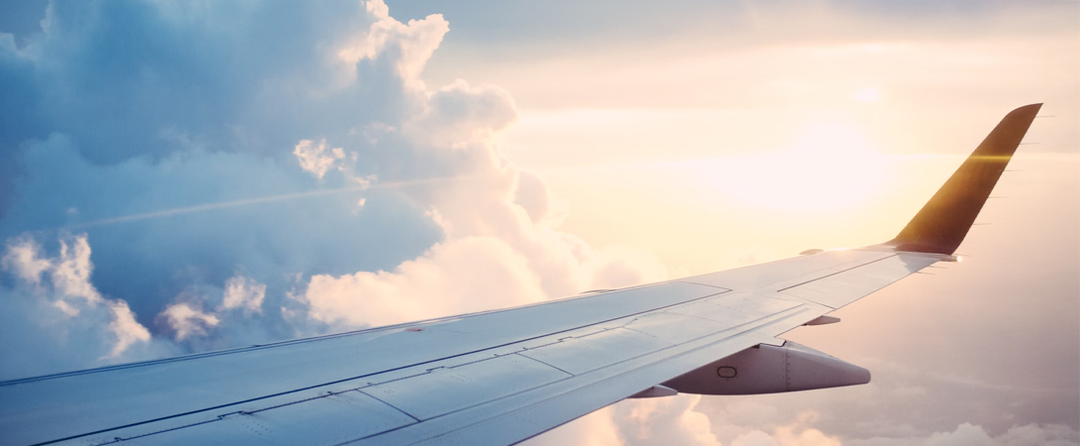 Wing of a plane in the clouds